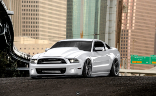 Bagged and Boosted S197 Mustang Showcasing Cowl Hood