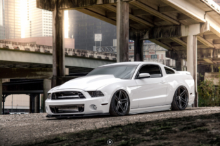 Bagged and Boosted S197 Mustang Showcasing Cowl Hood