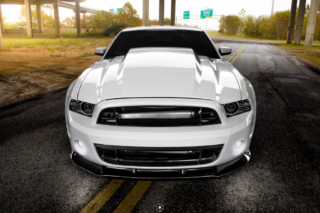 Bagged and Boosted S197 Mustang Showcasing Cowl Hood