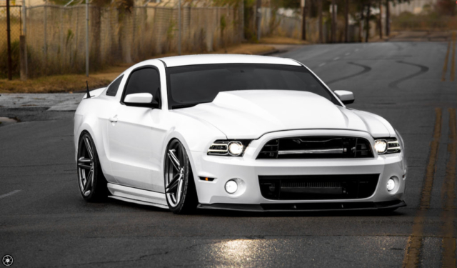 Bagged and Boosted S197 Mustang Showcasing Cowl Hood